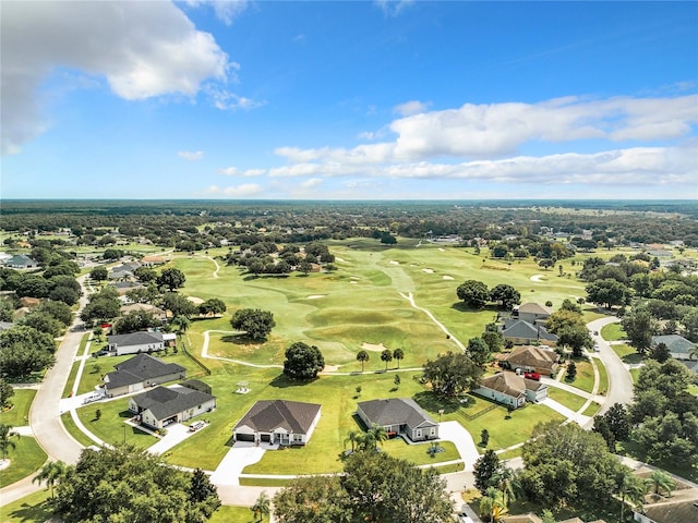 aerial view with golf course view and a residential view