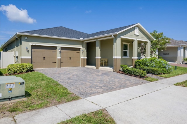 view of front of home with covered porch and a garage