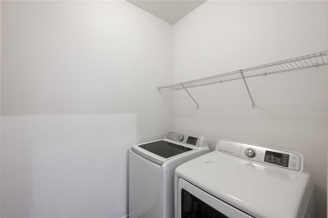 washroom featuring independent washer and dryer