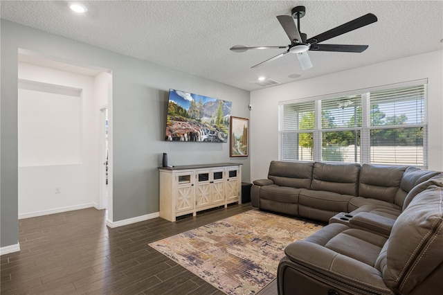 living room featuring a textured ceiling, dark hardwood / wood-style flooring, and ceiling fan