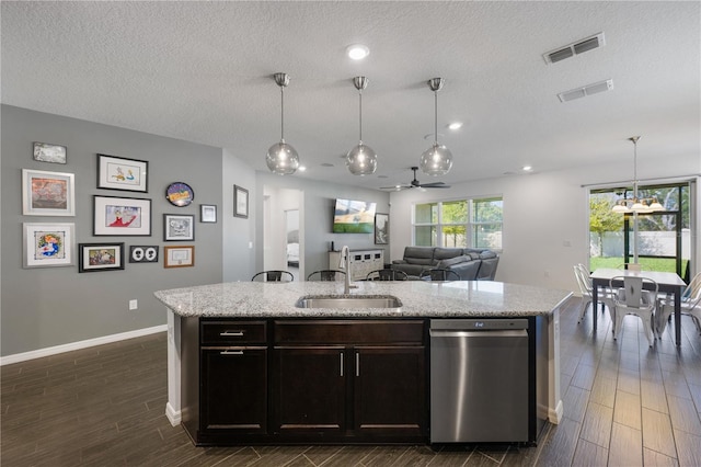 kitchen featuring dark hardwood / wood-style flooring, a textured ceiling, ceiling fan, sink, and pendant lighting