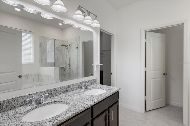 bathroom with vanity, tile patterned floors, and a shower with door