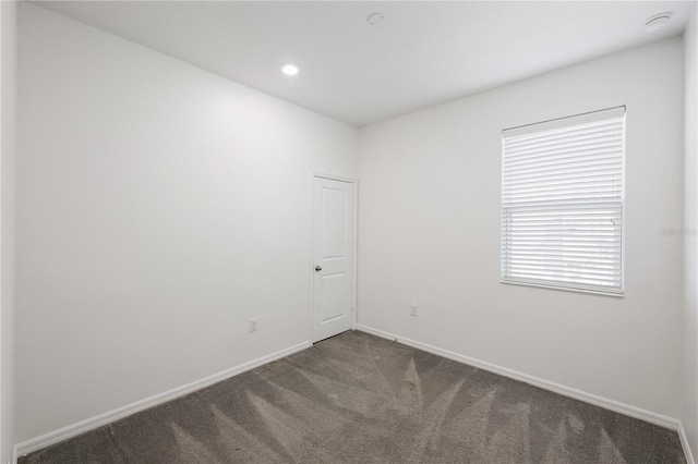 unfurnished room featuring carpet floors