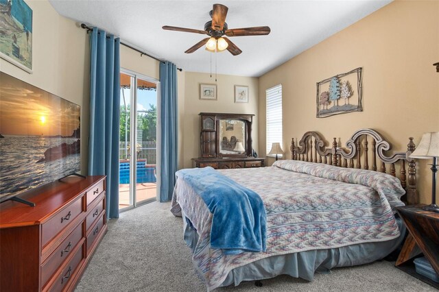 bedroom with access to outside, light colored carpet, and ceiling fan