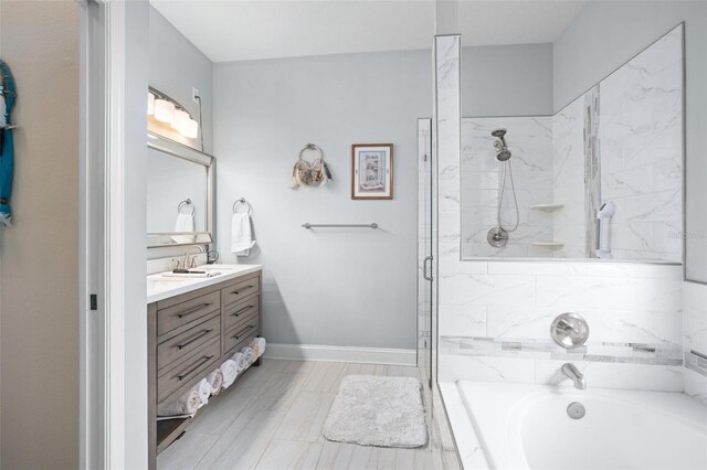 bathroom featuring vanity and separate shower and tub