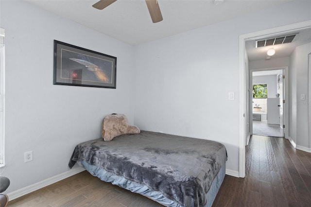 bedroom featuring ceiling fan and dark hardwood / wood-style floors