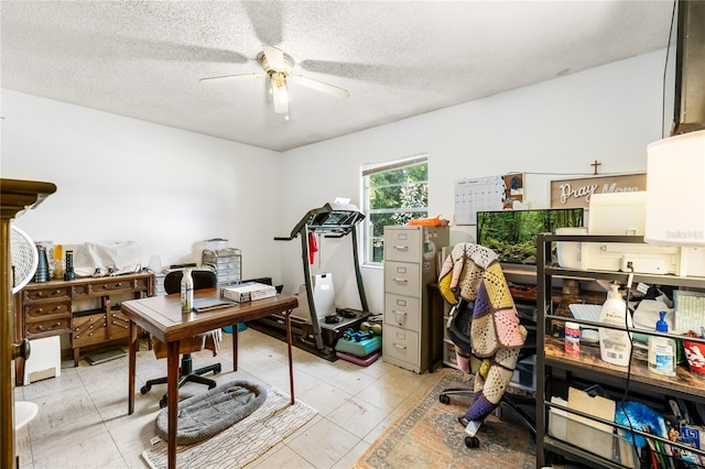 office area with ceiling fan and a textured ceiling