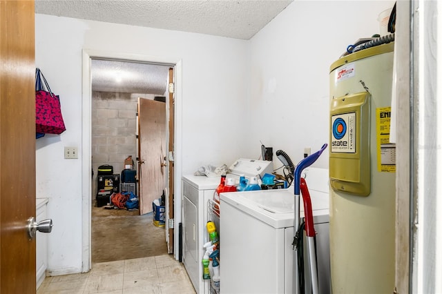 laundry room featuring washer and dryer and a textured ceiling