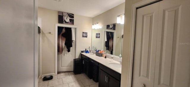 bathroom with tile patterned floors and vanity