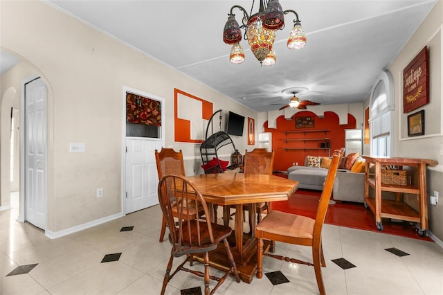 dining space with ceiling fan and light tile patterned floors