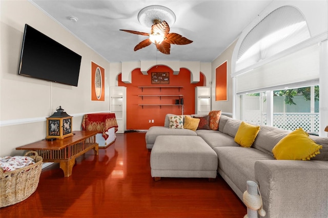 living room featuring ceiling fan and hardwood / wood-style floors