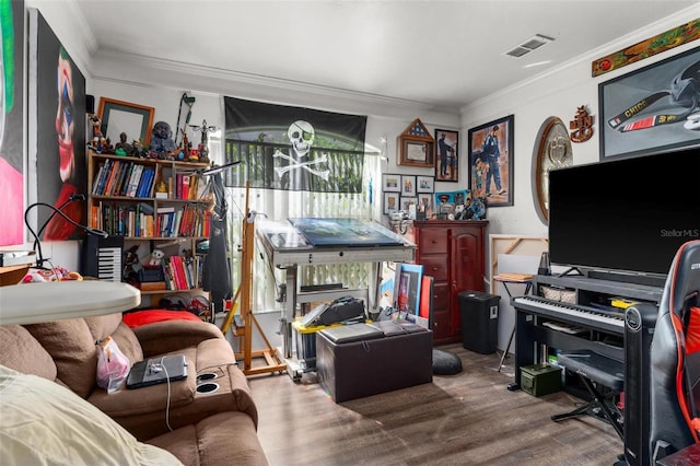 home office with ornamental molding and hardwood / wood-style floors