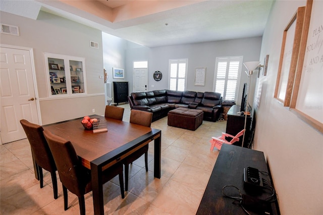 dining area with light tile patterned floors