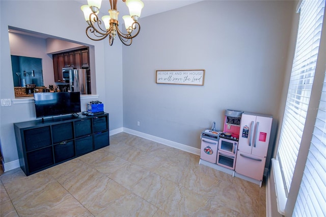 recreation room with an inviting chandelier