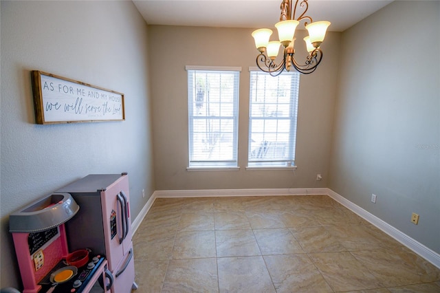 interior space featuring an inviting chandelier and light tile patterned flooring