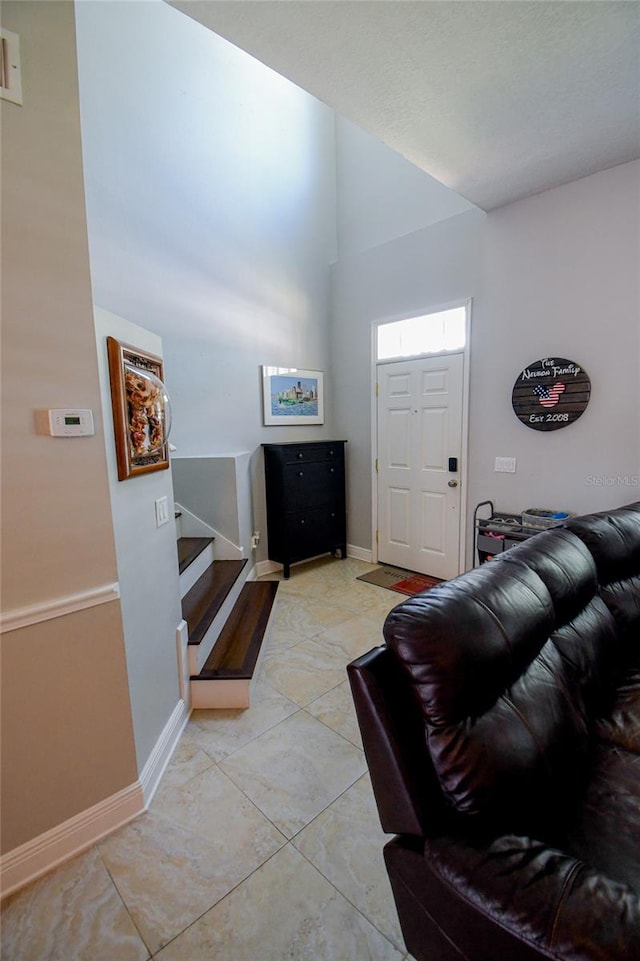 entryway with light tile patterned flooring