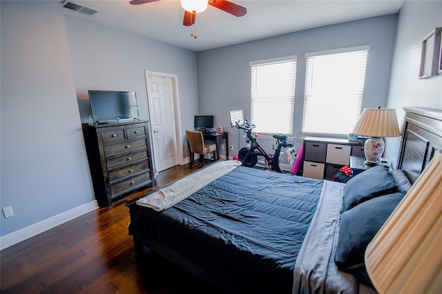 bedroom featuring ceiling fan and dark wood-type flooring