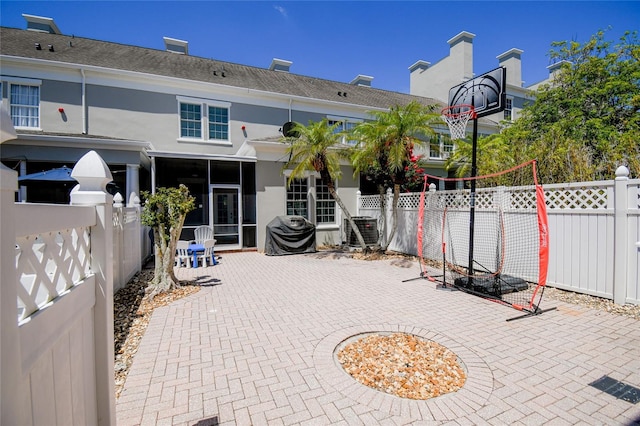 view of patio / terrace with central AC and a grill