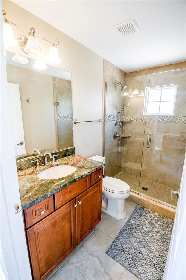 bathroom featuring walk in shower, vanity, and toilet