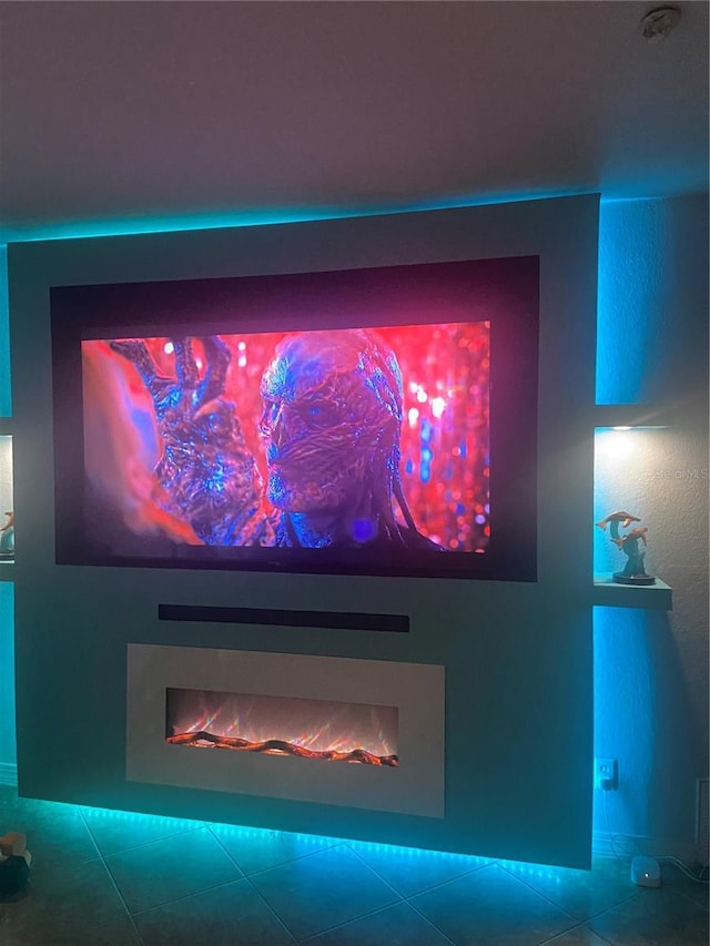 interior details with a lit fireplace
