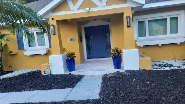 view of exterior entry with concrete block siding