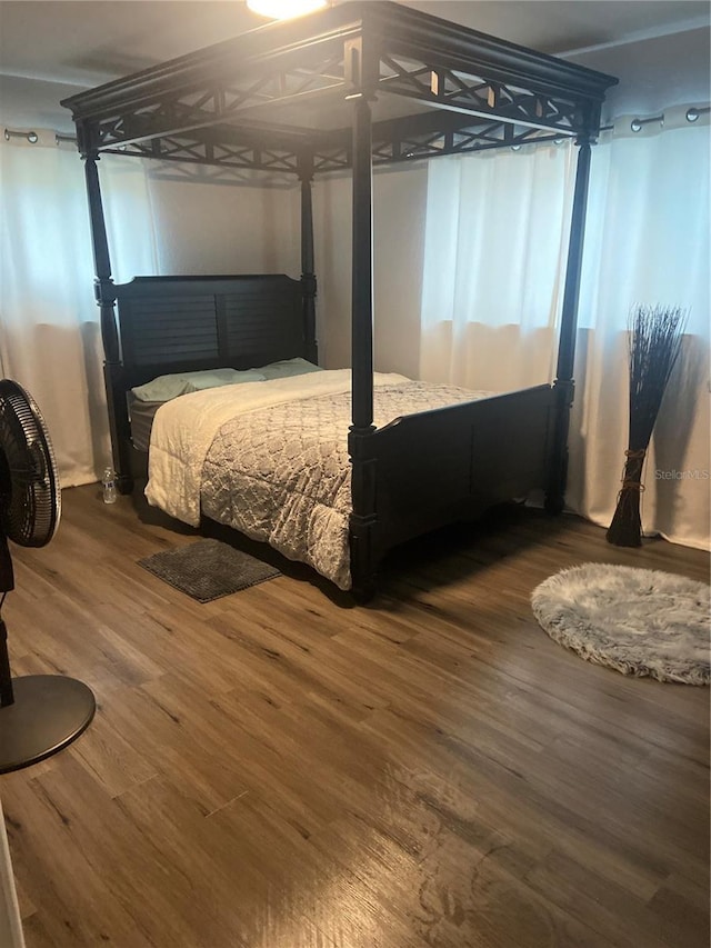 bedroom featuring wood finished floors