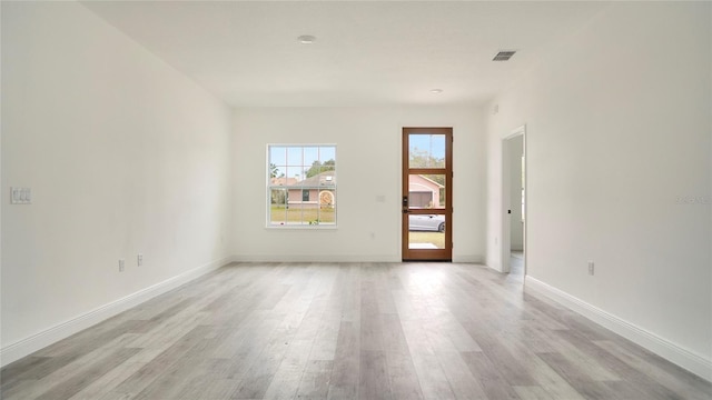 unfurnished room with light hardwood / wood-style flooring