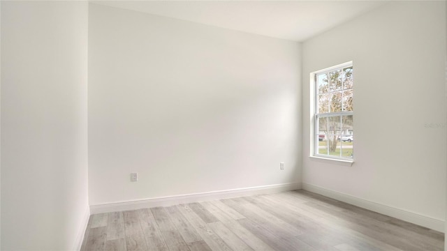 spare room featuring light hardwood / wood-style floors