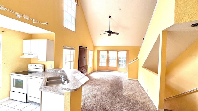 kitchen featuring white appliances, sink, light carpet, white cabinets, and high vaulted ceiling