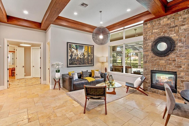 living room with beam ceiling and a stone fireplace