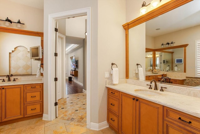 bathroom with vanity and tasteful backsplash