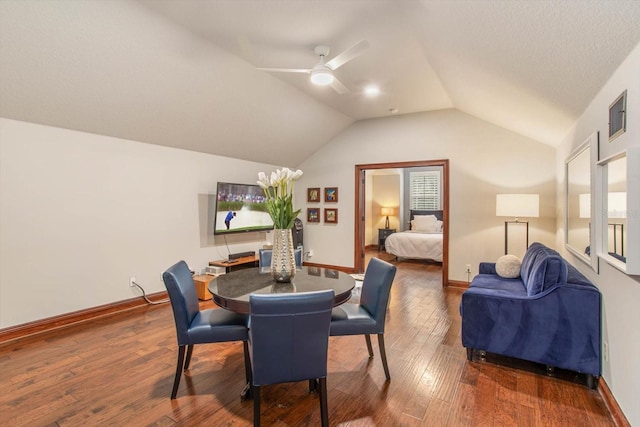 dining room featuring vaulted ceiling, ceiling fan, and hardwood / wood-style flooring