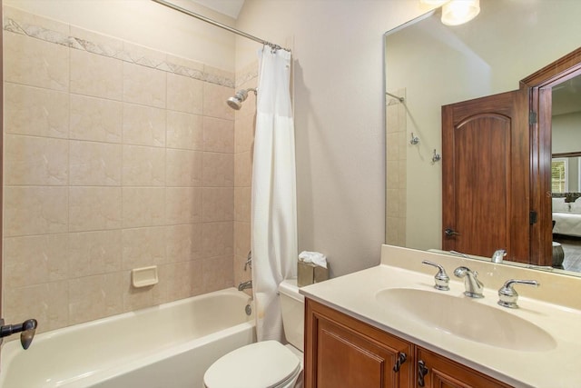 full bathroom with shower / bath combination with curtain, vanity, and toilet