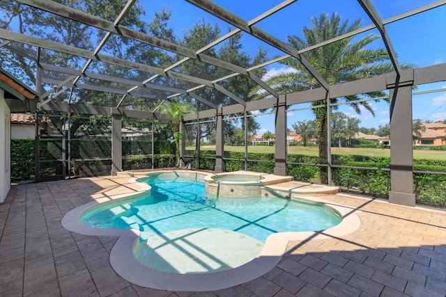 view of swimming pool featuring a lanai, an in ground hot tub, and a patio area