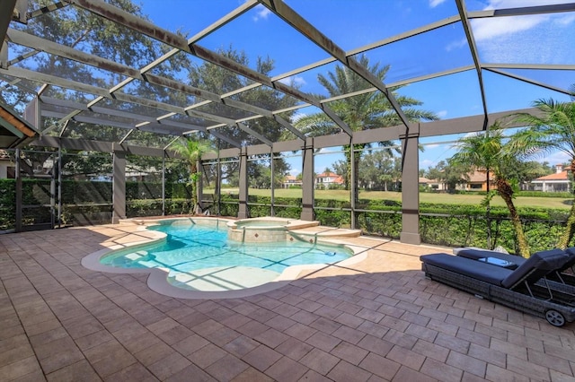 view of swimming pool featuring a patio, an in ground hot tub, and glass enclosure