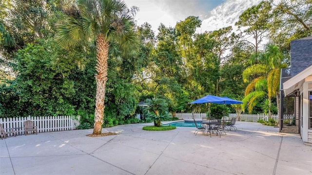 view of patio featuring a fenced in pool