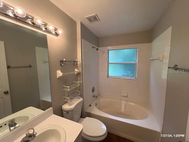 full bathroom featuring vanity, toilet, and washtub / shower combination