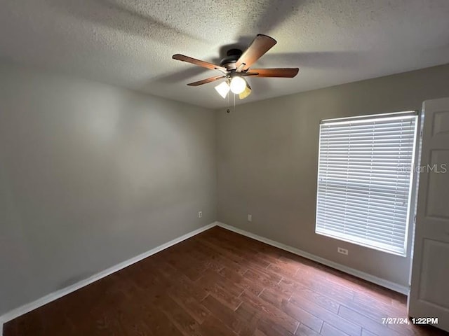 spare room featuring ceiling fan, hardwood / wood-style floors, and a textured ceiling