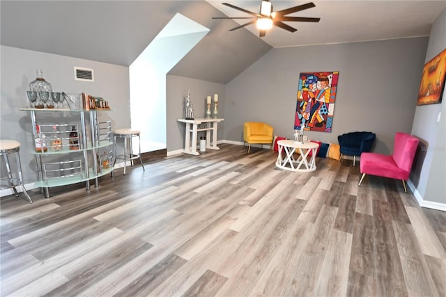 playroom with ceiling fan, wood-type flooring, and lofted ceiling