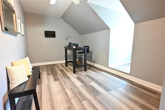 office space with hardwood / wood-style floors and vaulted ceiling