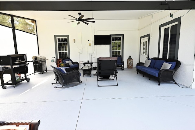 view of patio featuring grilling area, outdoor lounge area, and ceiling fan