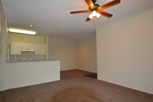 unfurnished living room featuring a textured ceiling, dark carpet, and ceiling fan