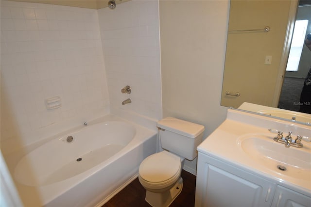 full bathroom featuring vanity, toilet, and tiled shower / bath