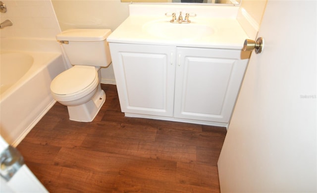 full bathroom with shower / bathtub combination, vanity, toilet, and hardwood / wood-style flooring