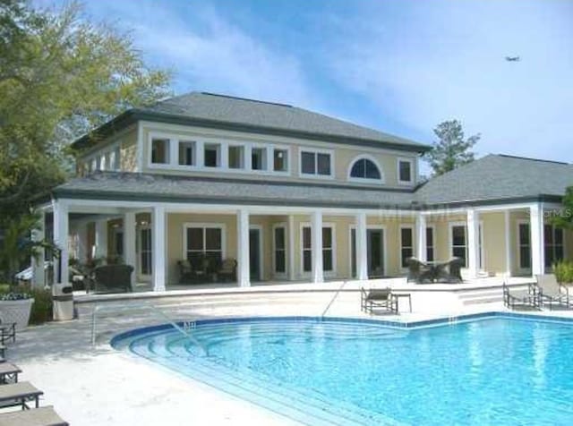 rear view of property featuring a patio