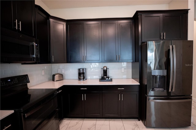 kitchen with stainless steel appliances and backsplash