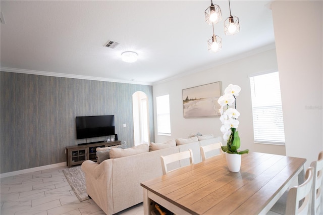 dining area with ornamental molding