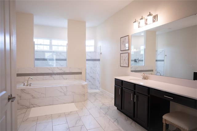 bathroom featuring vanity and separate shower and tub