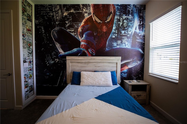 carpeted bedroom with multiple windows