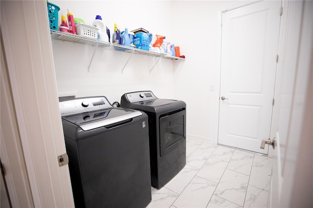 laundry area with washing machine and clothes dryer